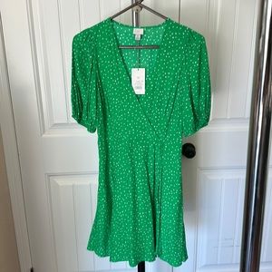 Brand new with tags.  Size X Small.  Green and white polka dot dress.